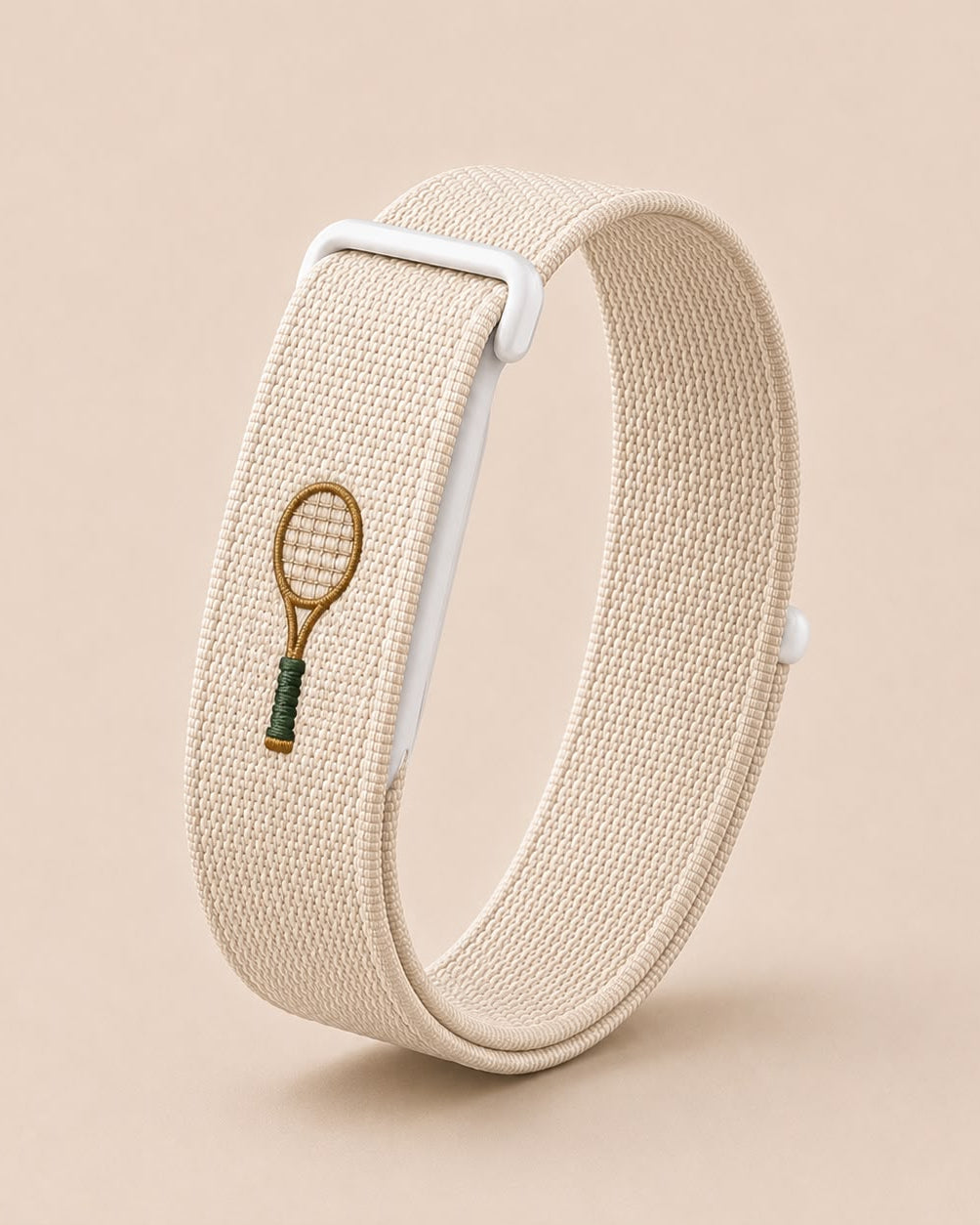 Ecru tennis embroidered band mounted on a Fitbit tracker - Lorenzi Paris